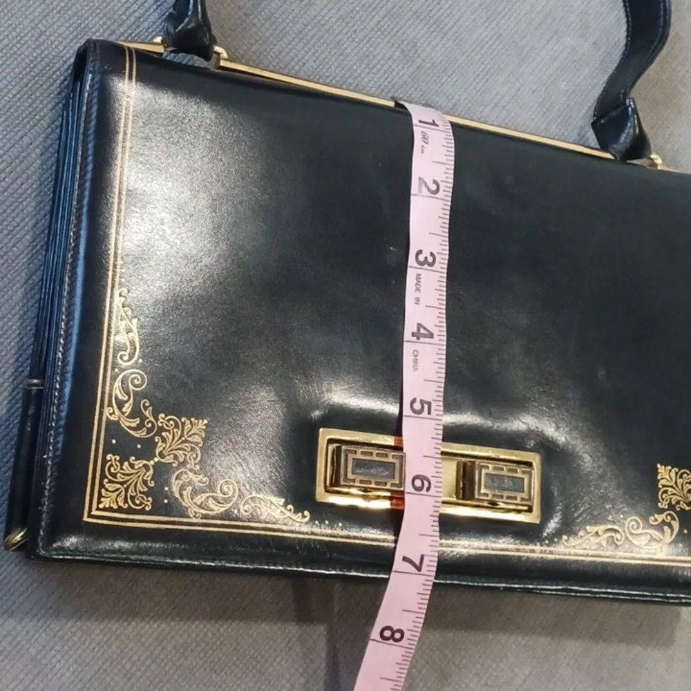 Black Shoulder Bag with Gold Accents